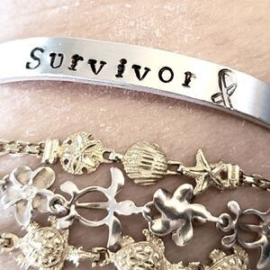 Survivor, Aluminum cuff br…